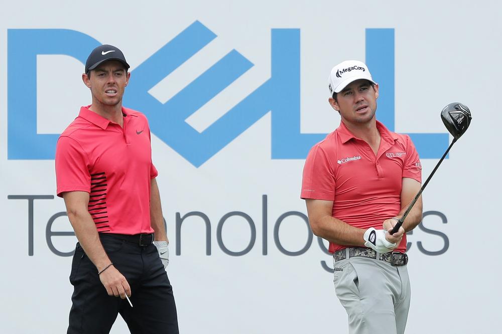 Rory McIlroy of Northern Ireland looks on as Brian Harman of the United States plays his shot from the 15th tee during the third round of the World Golf Championships-Dell Match Play at Austin Country Club Friday. — AFP