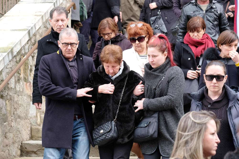 Mourners leave the service of remembrance at the Saint Etienne Church in Trebes in southwest France, on Sunday, two days after a man carried out an attack in which four people were killed. — AFP 