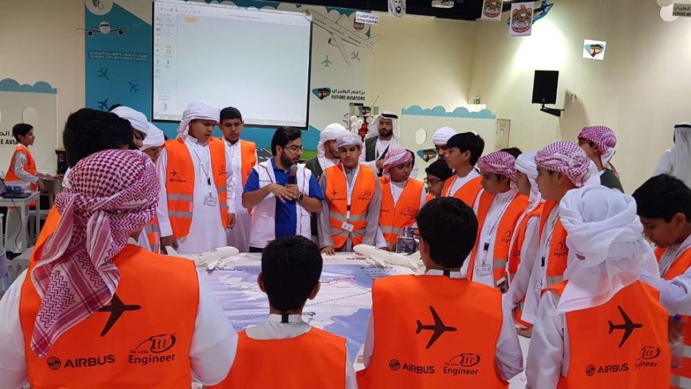 60  Emirati students (males and females) between the ages of  13 and 15 years old, pose with instructors and officials at the Airbus Little Engineer A380 assembly workshop in Fujairah. — Courtesy photo