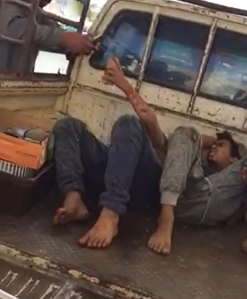 A video that went viral on social media shows two injured men being taken to hospital on the back of a truck.