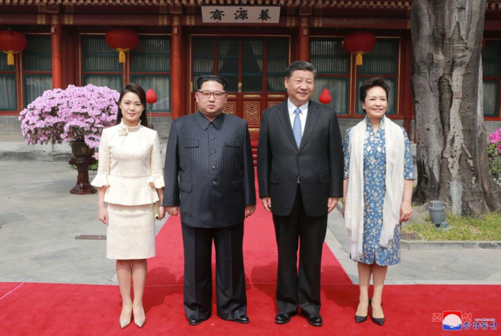 North Korean leader Kim Jong Un and wife Ri Sol Ju, and Chinese President Xi Jinping and wife Peng Liyuan toast each other, as Kim Jong Un paid an unofficial visit to Beijing, China, in this undated photo released by North Korea's Korean Central News Agency (KCNA) in Pyongyang March 28, 2018. — Reuters