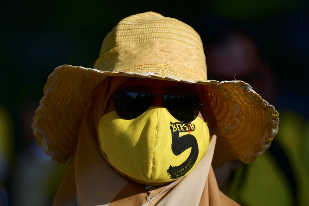 A supporter of pro-democracy group Bersih protests against a controversial proposal to redraw electoral boundaries outside near the Parliament House in Kuala Lumpur, Malaysia, on Wednesday. — Reuters