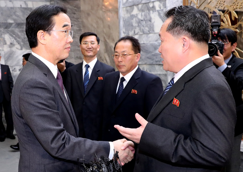 South Korean Unification Minister Cho Myoung-gyon talks with his North Korean counterpart Ri Son Gwon as he leaves after their meeting at the truce village of Panmunjom, North Korea, on Thursday. — Reuters