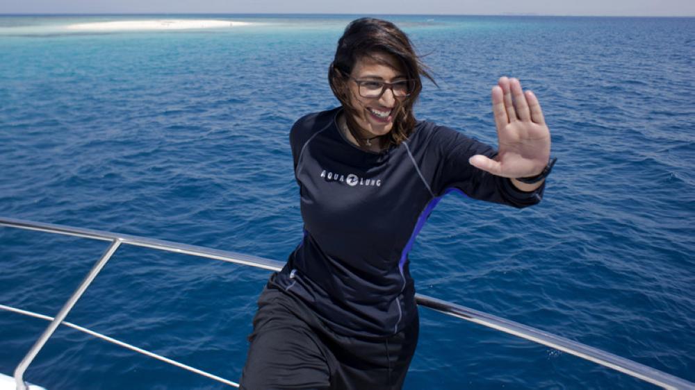 In this March 7 photo, Nouf Alosaimi, a 29-year-old Saudi diving instructor, prepares to explore the waters off a sandy island in the Red Sea near King Abdullah Economic City.