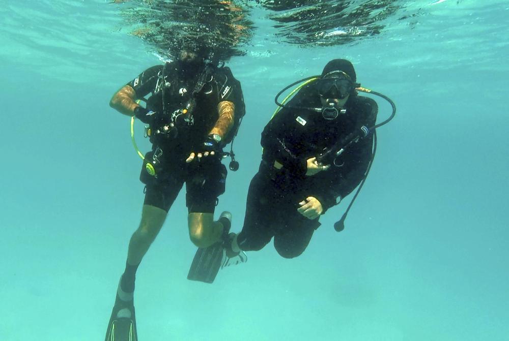 In this March 7 photo, Nouf Alosaimi, a 29-year-old Saudi diving instructor, prepares to explore the waters off a sandy island in the Red Sea near King Abdullah Economic City.