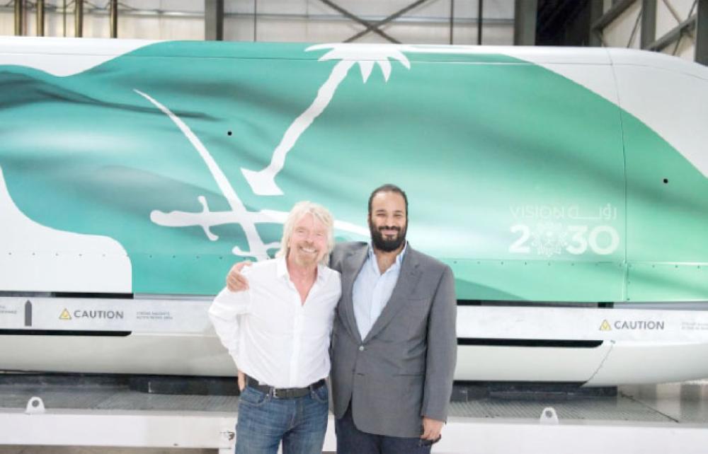 Crown Prince Muhammad Bin Salman, deputy premier and minister of defense, poses for a photo with Richard Branson, founder of Virgin Group and Chairman of the Board of Directors of Virgin Galactic, during a tour to the facility in Mojave in California early on Monday. — SPA photos