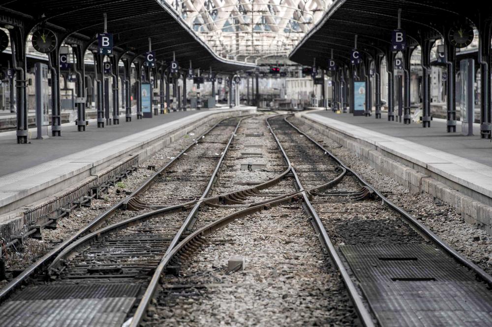 Deserted train platforms are seen at Gare de l’Est train station in Paris on Tuesday, at the start of three months of rolling rail strikes. — AFP