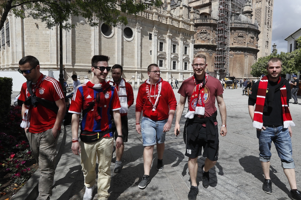 Bayern Munich's supporters go for a walk downtown Seville, Spain, Tuesday. Bayern will face Sevilla FC in a Champions League quarterfinals first leg soccer match later at Sanchez Pizjuan stadium.  — EPA