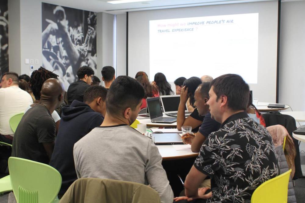 Students participate in a class at Code Your Future, a free website coding and computer programming bootcamp for asylum seekers and refugees run by volunteers working in the tech industry, in central London. - Thomson Reuters Foundation