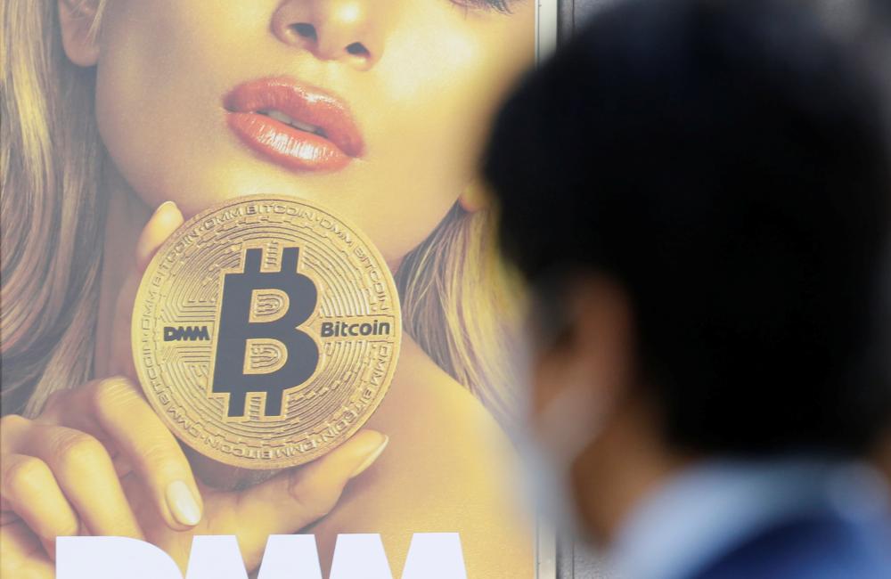 Ryo Fukuda, a software engineer at Next Currency Inc, a company seeking to launch a cryptocurrency exchange, poses for a photo after an interview with Reuters at the company's headquarters in Tokyo, Japan. — Reuters
