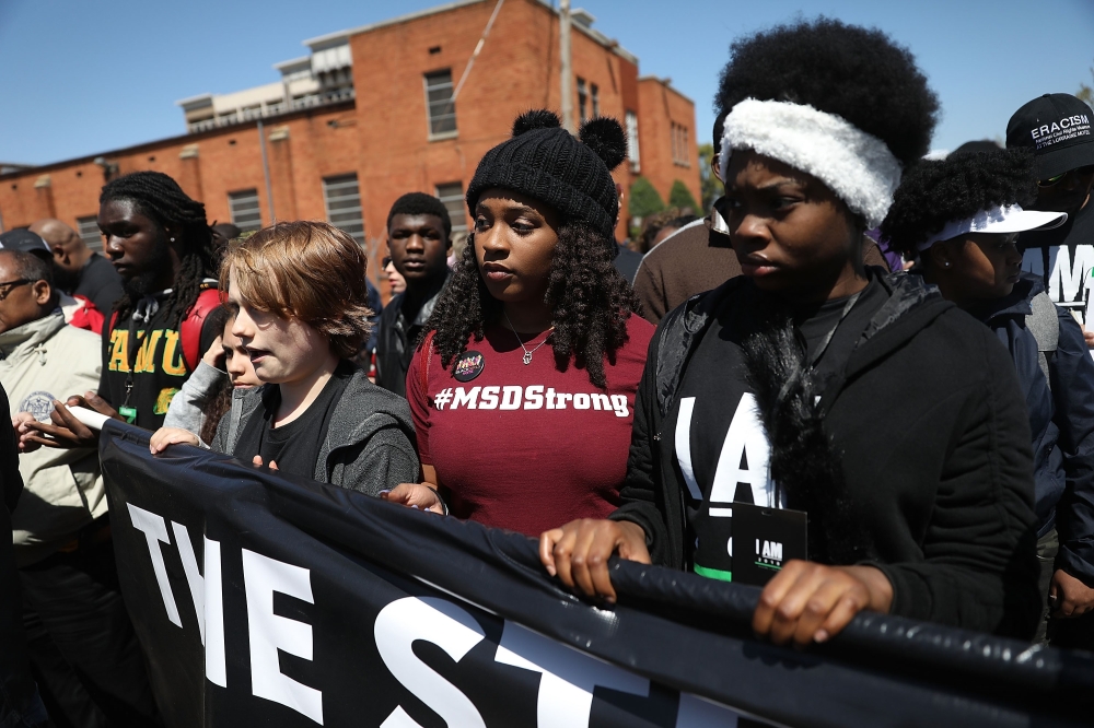 Marjory Stoneman Douglas High School mass shooting survivor Mei-Ling Ho-Shing,17, second right, joins others during an event to mark the 50th anniversary of Dr. Martin Luther King Jr.’s assassination in Memphis, Tennessee, in this April 4, 2018 file photo. — AFP