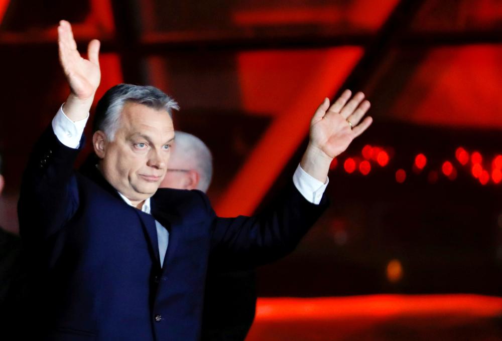 Hungarian Prime Minister Viktor Orban addresses the supporters after the announcement of the partial results of parliamentary election in Budapest, Hungary, on Sunday. — Reuters