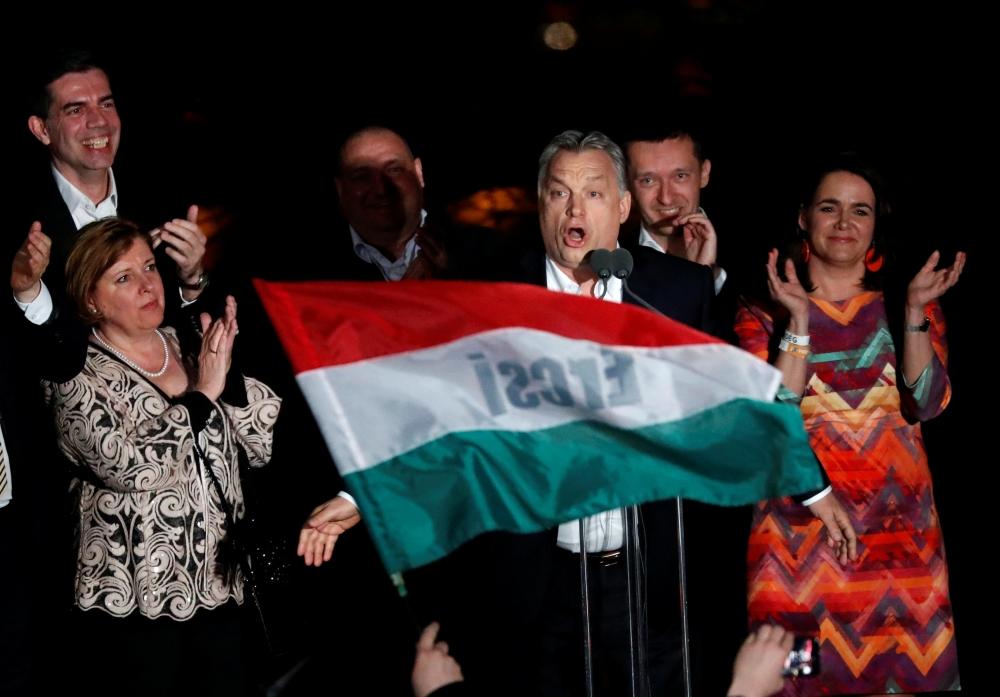 Hungarian Prime Minister Viktor Orban addresses supporters after the announcement of the partial results of parliamentary election in Budapest, Hungary, April 8, 2018. — Reuters