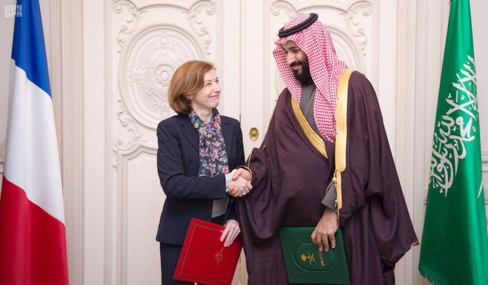 French President Emmanuel Macron (R) welcomes Saudi Arabia's Crown Prince Muhammad Bin Salman upon his arrival at the Elysee Presidential palace for a meeting on April 10, 2018 in Paris. — AFP