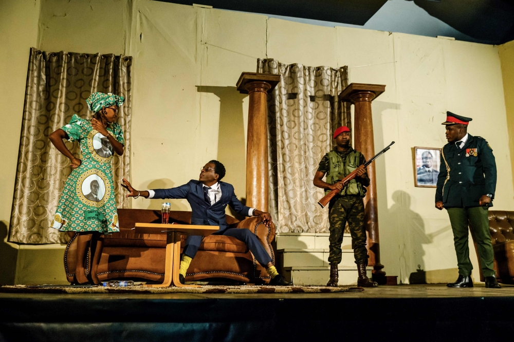 Theater actress Carol Magenga (left) interpreting Zimbabwe's former first lady Grace Mugabe and theater actor Khetani Banda (right) in the role of former Zimbabwe's president Robert Mugabe perform on stage during a satirical play called 