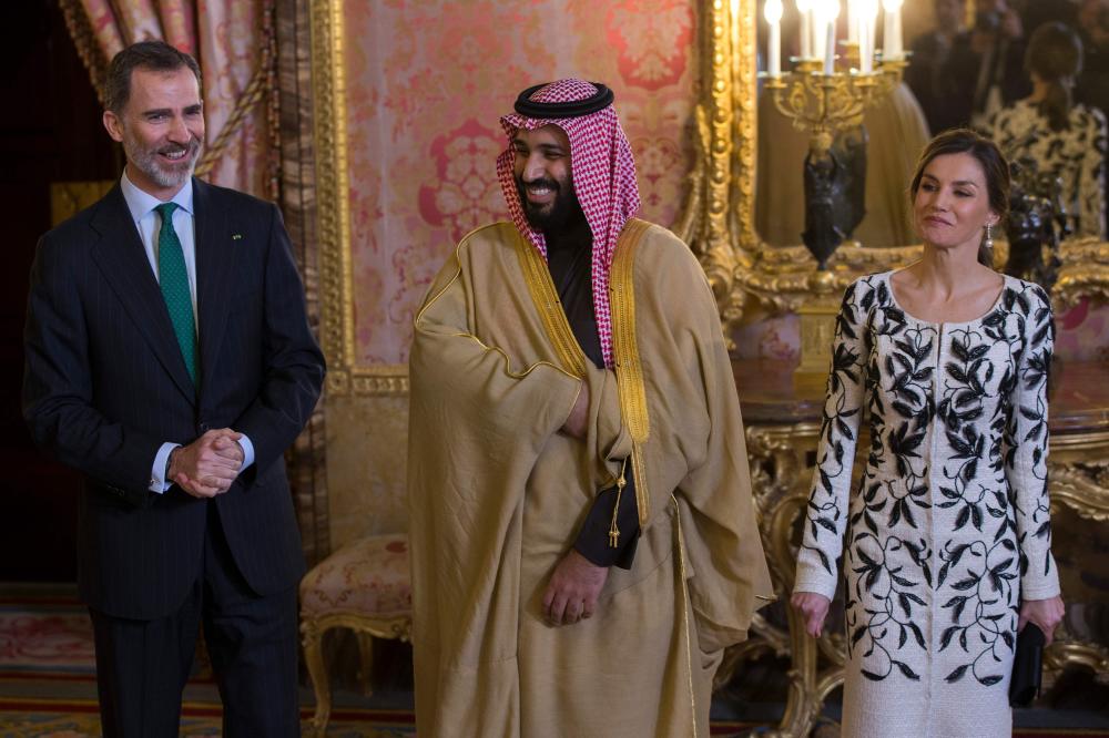 Crown Prince Muhammad Bin Salman (center) poses with Spain's King Felipe VI (left) and his wife Queen Letizia before a lunch at the Royal Palace in Madrid, Thursday. — AFP