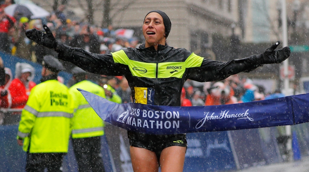 Yuki Kawauchi of Japan and Desiree Linden of the US celebrate with the trophy after winning the men's and women's divisions of the 122nd Boston Marathon in Boston, Massachusetts, US, Monday. — Reuters