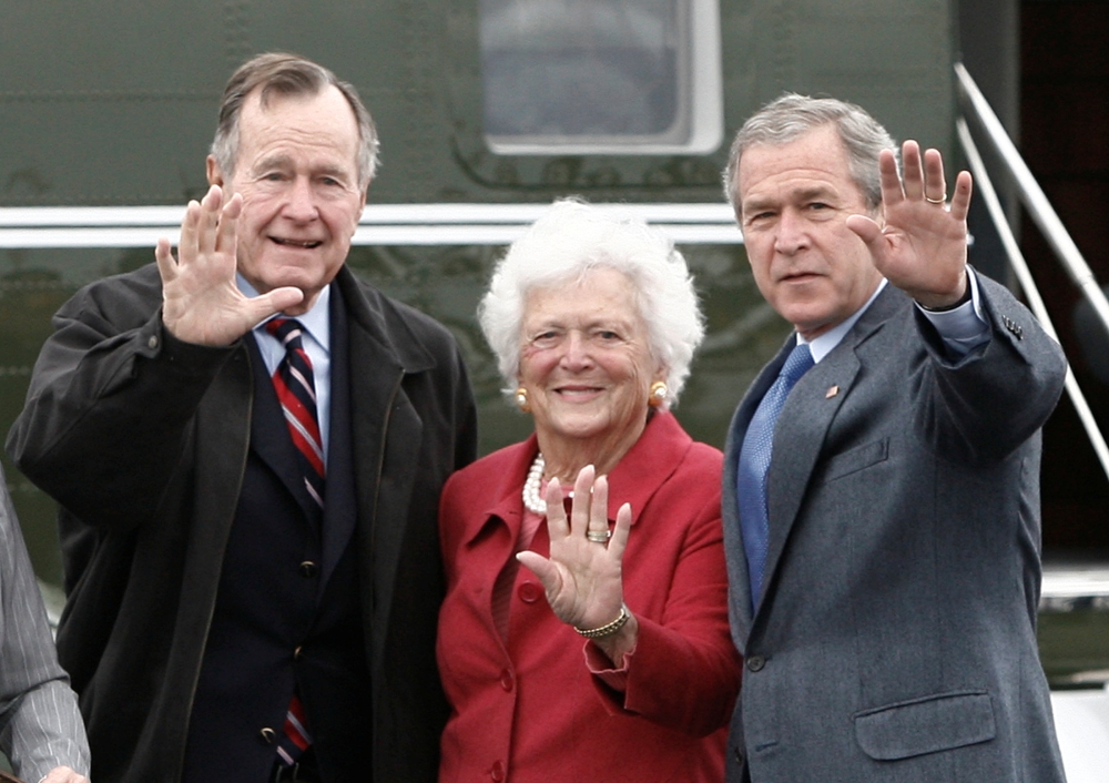 Former US President George W. Bush, right, waves alongside his parents, former President George H.W. Bush and former first lady Barbara Bush upon their arrival Fort Hood, Texas, in this April 8, 2007 file photo. — Reuters