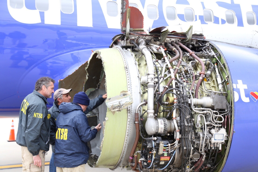 US NTSB investigators are on scene examining damage to the engine of the Southwest Airlines plane in this image released from Philadelphia, Pennsylvania, on Tuesday. — Reuters