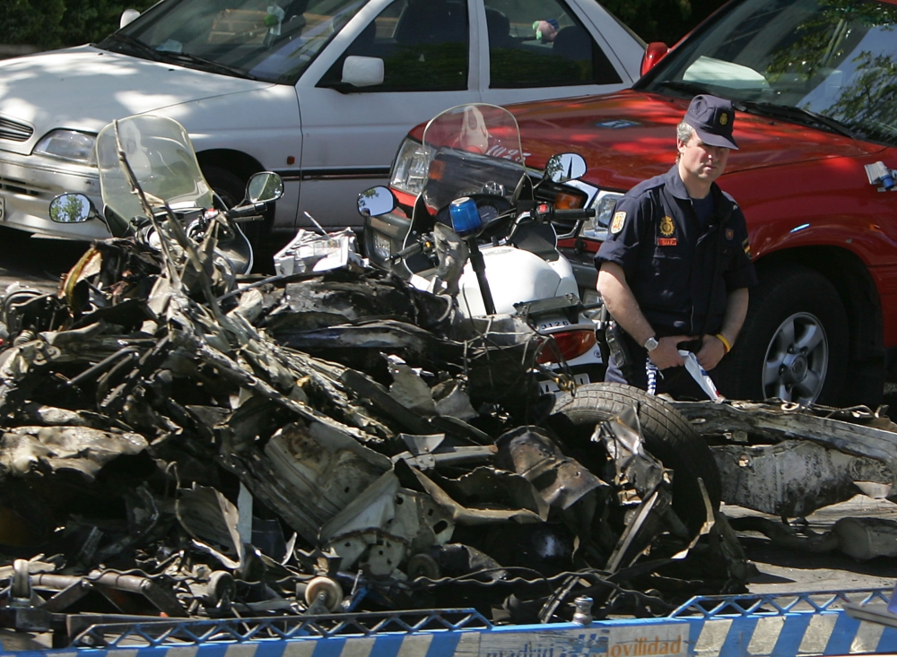In this file photo taken on May 25, 2005 the car in which a bomb exploded is towed by police in the Spanish capital Madrid. — AFP