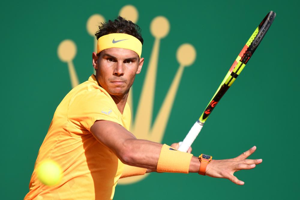 Spain's Rafael Nadal returns a ball to Russia's Karen Khachanov during their match at the Monte-Carlo ATP Masters Series Tournament Thursday. — AFP