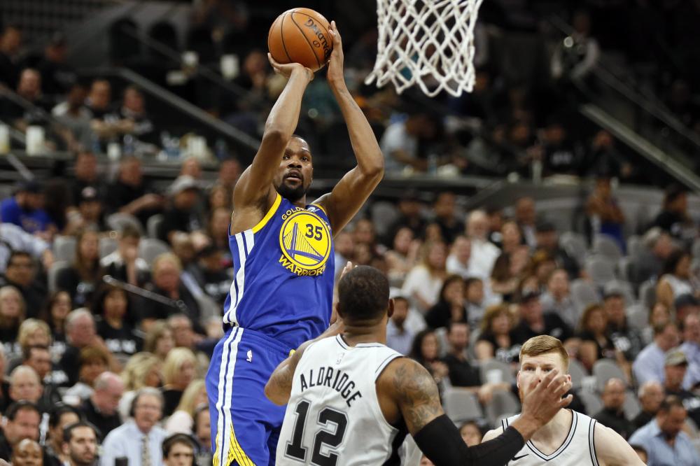 Golden State Warriors’ forward Kevin Durant shoots the ball over San Antonio Spurs’ power forward LaMarcus Aldridge in Game 3 of the NBA playoffs at AT&T Center in San Antonio Thursday. — Reuters