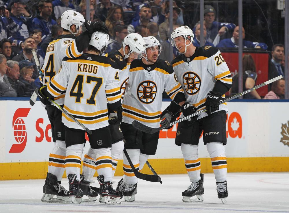 Brad Marchand (2nd R) of the Boston Bruins celebrates a goal against the Toronto Maple Leafs in Game 4 of the Eastern Conference NHL play-offs at the Air Canada Centre in Toronto Thursday. — AFP 