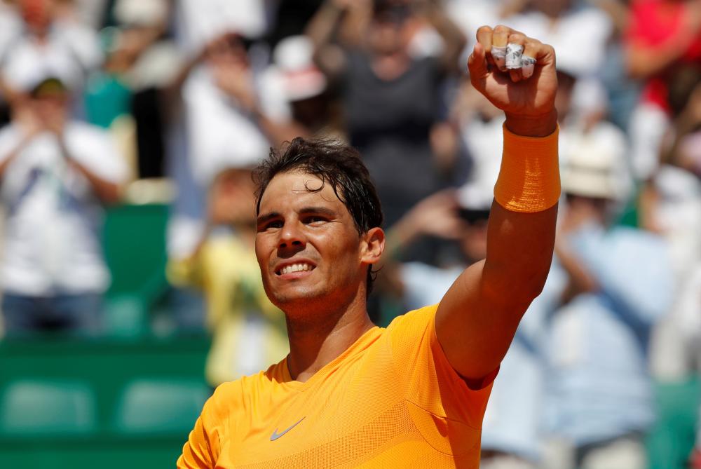 Spain’s Rafael Nadal celebrates after winning his quarterfinal match against Austria’s Dominic Thiem at Monte Carlo Masters Friday. — Reuters