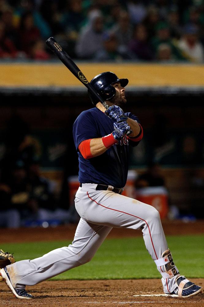 Mitch Moreland of the Boston Red Sox hits a grand slam home run against the Oakland Athletics during their MLB game at the Oakland Coliseum in Oakland, California, Friday. — AFP