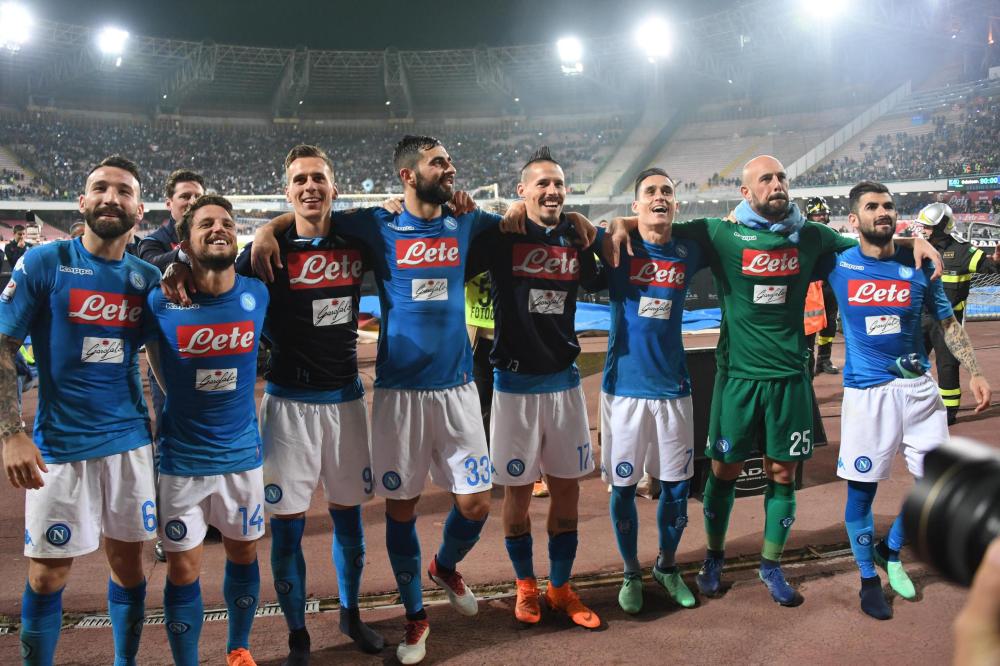 Napoli’s players celebrate their win over Udinese in the Italian Serie A soccer match at San Paolo Stadium in Naples Thursday. — EPA