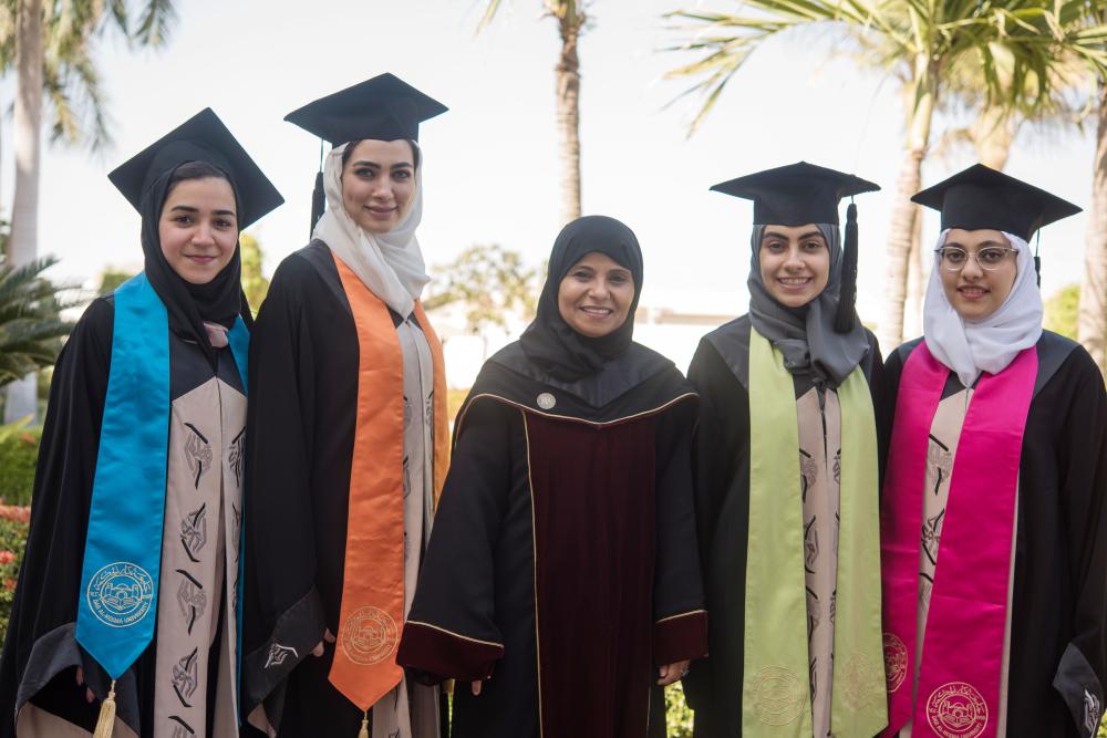 Sanaa Askool, dean of students affairs (center), with students that have graduated. — Courtesy photo