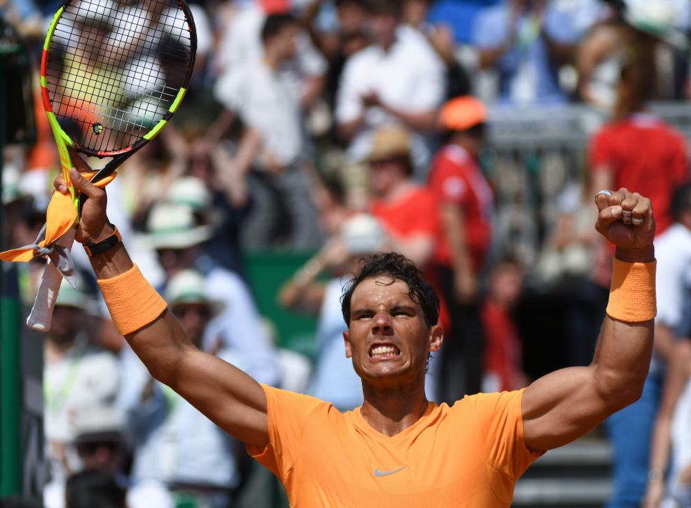 Spain’s Rafael Nadal celebrates after his victory against Bulgaria’s Grigor Dimitrov at the Monte-Carlo ATP Masters Series Tournament Saturday. — AFP