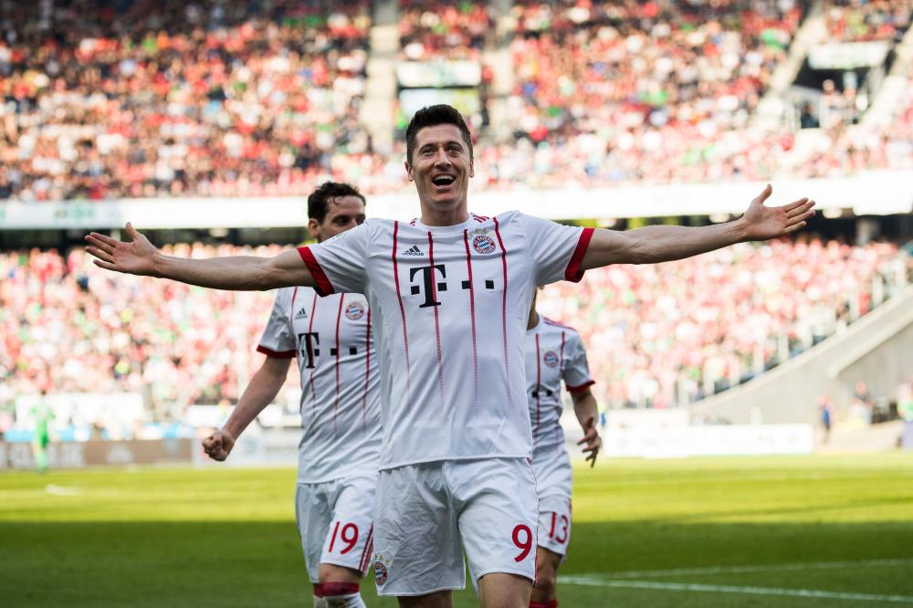 Bayern Munich's Robert Lewandowski celebrates scoring his team’s second goal against Hannover 96 during their German first division Bundesliga football match in Hanover Saturday. — AFP