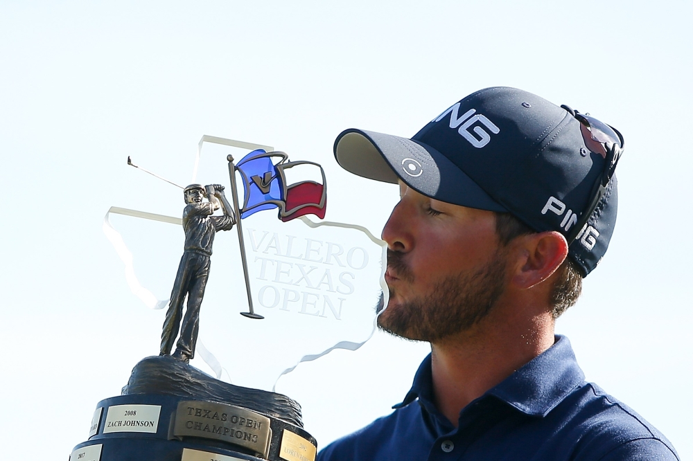 Andrew Landry holds the Valero Texas Open trophy for a photo after the final round of the Valero Texas Open at TPC San Antonio AT&T Oaks Course on Sunday in San Antonio, Texas. — AFP
