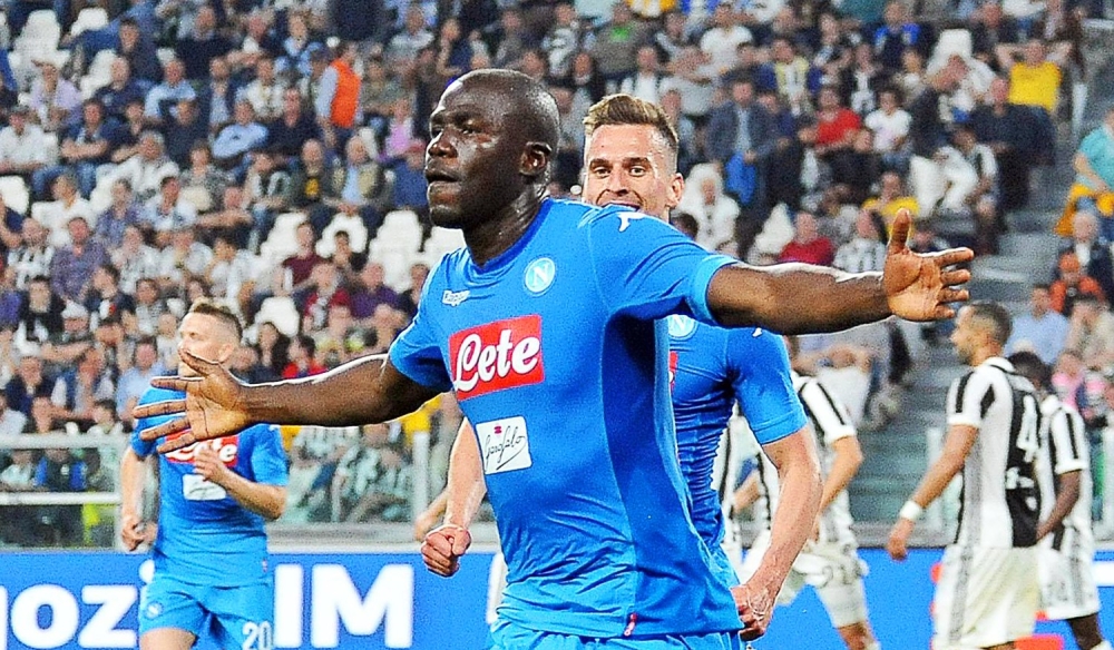 Napoli's Kalidou Koulibaly (front) celebrates after scoring the 1-0 lead during the Italian Serie A soccer match between Juventus FC and SSC Napoli in Turin, Italy, on Sunday. — EPA