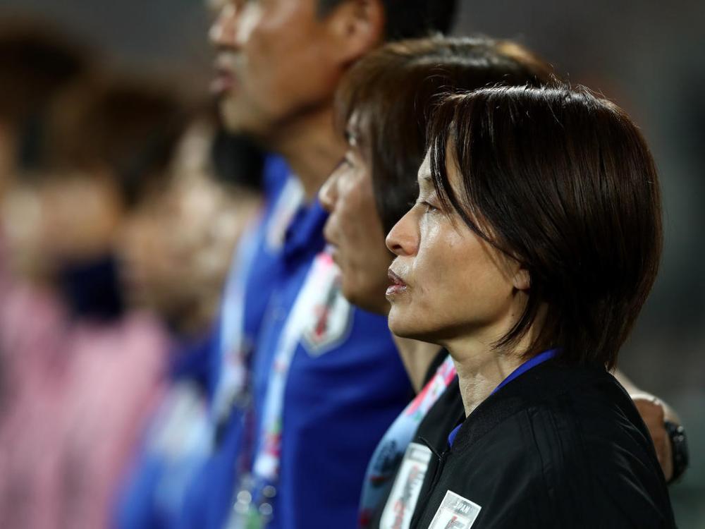 Head coach of Japan, Asako Takemoto looks on during national anthem prior to the AFC Women's Asian Cup semifinal match between China and Japan at the King Abdullah II Stadium in Amman, Jordan. — AFP