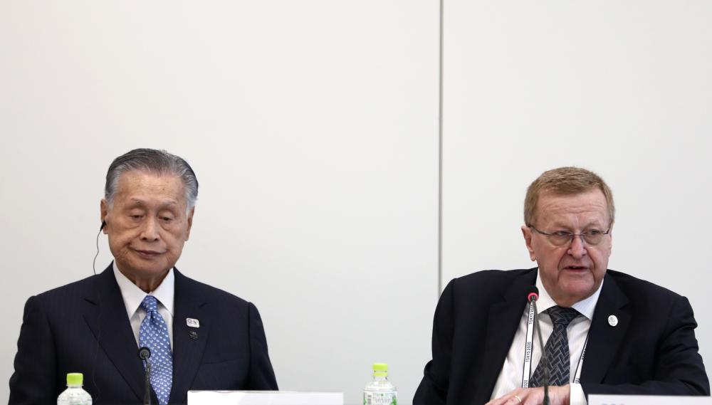 International Olympic Committee (IOC) vice president and chairman of the Coordination Commission for Tokyo 2020 John Coates (R) and Tokyo 2020 president Yoshiro Mori (L)attend the IOC project review meeting in Tokyo on Monday. A successful Winter Olympics in Pyeongchang has 