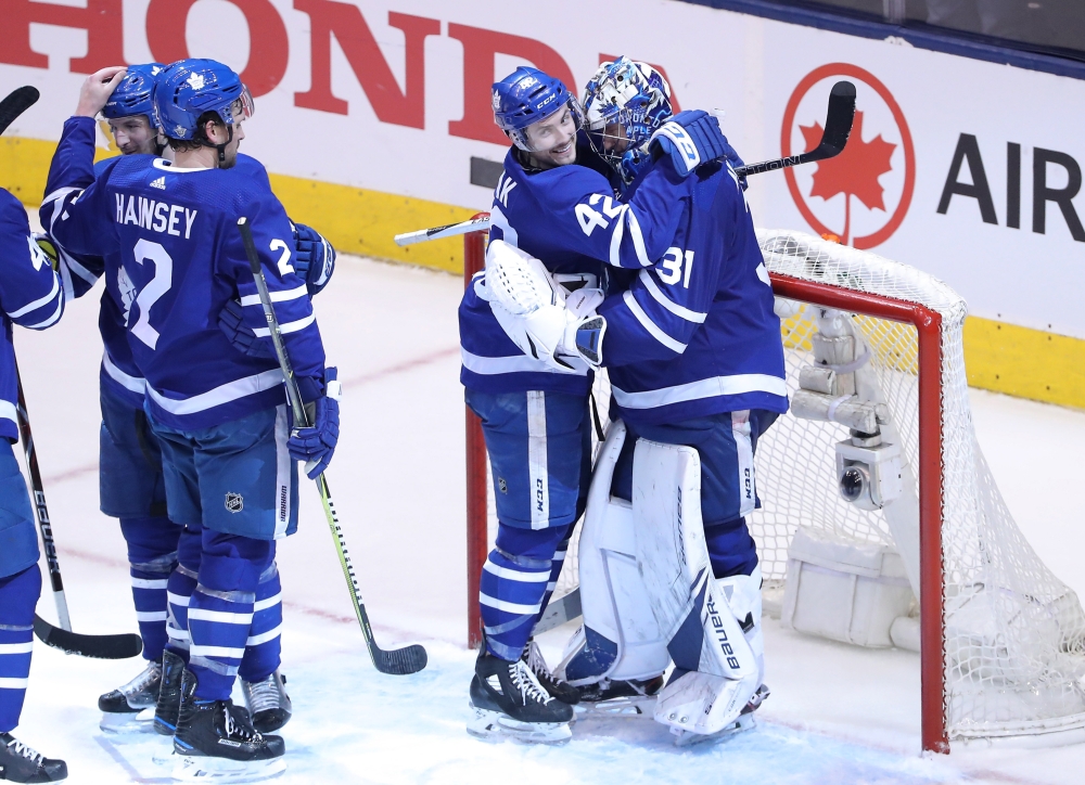 Toronto Maple Leafs center Tyler Bozak (42) celebrates with goalie Frederik Andersen (31) after defeating the Boston Bruins in game six of the first round of the 2018 Stanley Cup Playoffs at Air Canada Centre. The Maple Leafs beat the Bruins 3-1. — Reuters