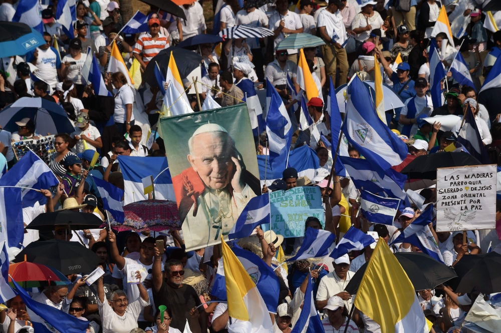 Nicaraguan Catholic faithful take part in an open air mass, to demand the end of violence in their country, outside the Metropolitan Cathedral in Managua on Saturday. — AFP