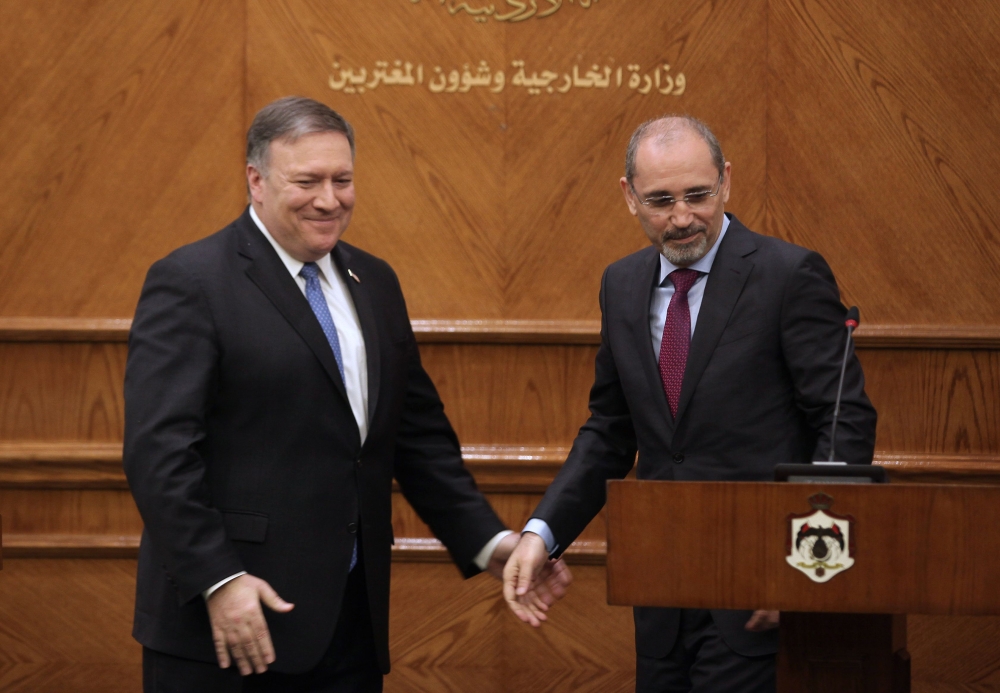 US Secretary of State Mike Pompeo (L) and Jordan Foreign Minister Ayman Safadi give a press conference in Amman on Monday. — AFP