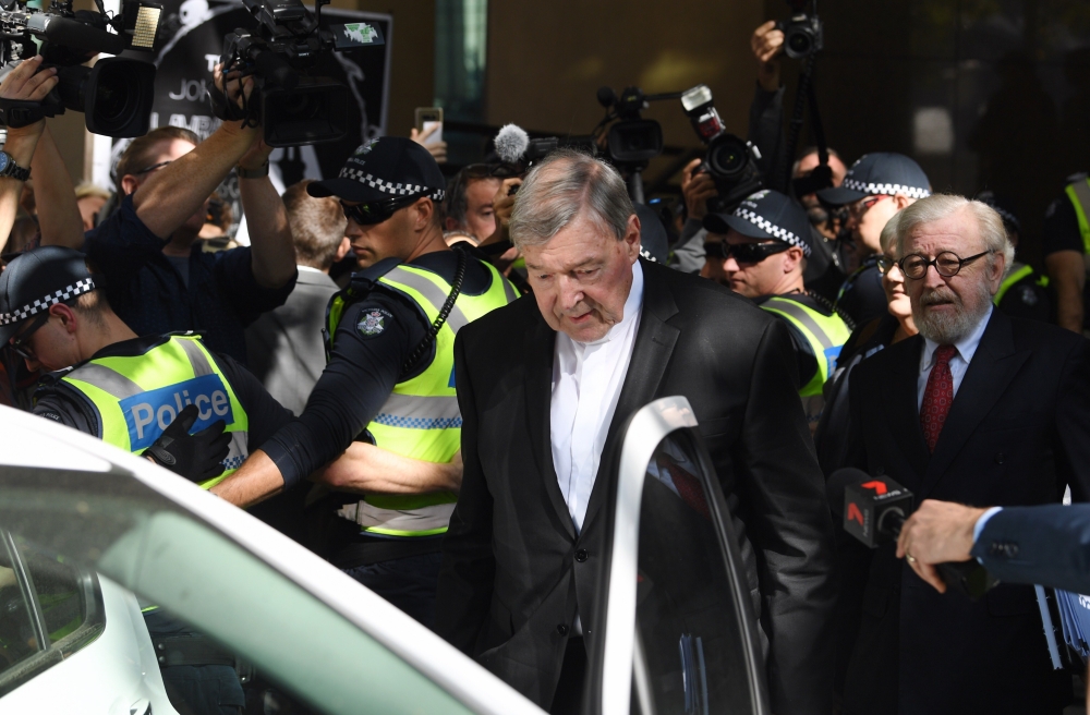 Australia’s most senior Catholic Cardinal George Pell, center, leaves the Melbourne Magistrates Court in Melbourne, Australia, on Tuesday. — EPA