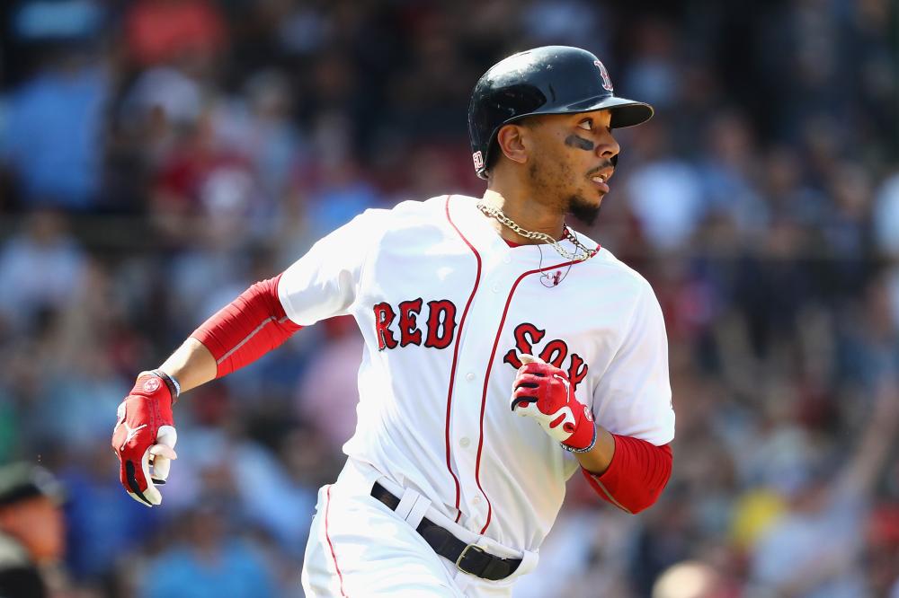 Mookie Betts of the Boston Red Sox runs the bases after hitting a solo home run during the seventh inning against the Kansas City Royals at Fenway Park in Boston Wednesday. — AFP 