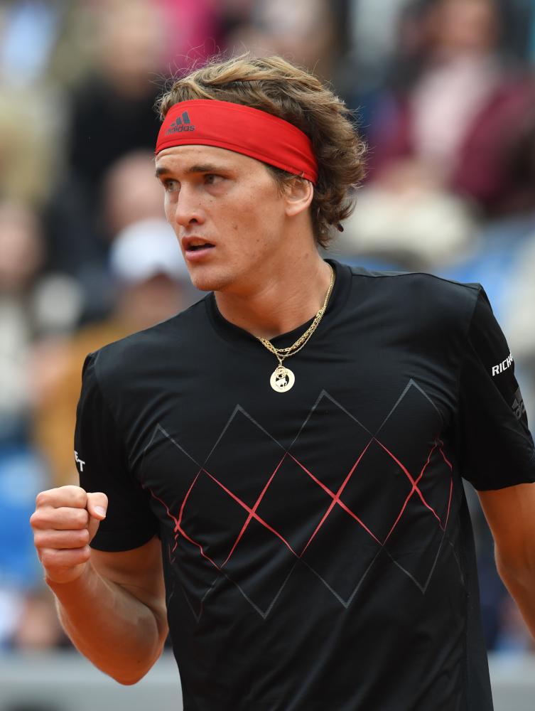 Germany's Alexander Zverev reacts after a point against Germany's Jan-Lennard Struff during their quarterfinal match at the ATP Tennis Open in Munich Friday. — AFP