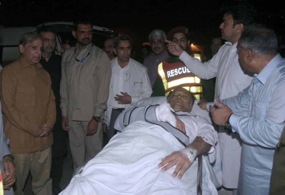 A handout photo made available by the Punjab Government shows Ahsan Iqbal, Pakistani Interior Minister being transported to a hospital after he was shot at by a gunman, in Lahore, Pakistan, Sunday. — EPA