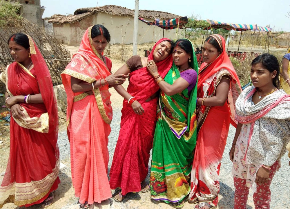 Indian relatives mourn following the rape and murder of a 16-year-old girl on May 3, at Raja Kundra Village in Chatra district of the eastern Indian state of Jharkhand, on Saturday. — AFP