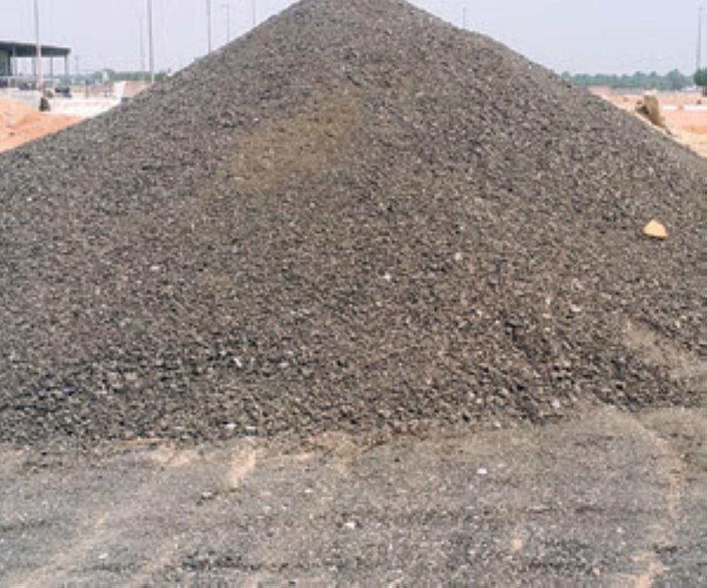 Those selling cement and sand and leasing equipment near the new housing plan said they are buying scrap asphalt for up to SR300 for the big load. — Courtesy photo