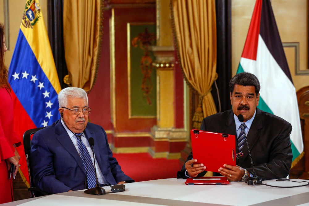 Venezuela's President Nicolas Maduro (R) and President of Palestine Mahmoud Abbas brief the press during their meeting at the presidential headquarters in Caracas, Venezuela. — EPA