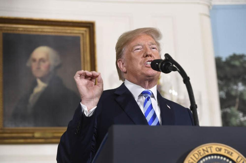 US President Donald Trump announces his decision on the Iran nuclear deal in the Diplomatic Reception Room at the White House in Washington, DC, on Tuesday. — AFP