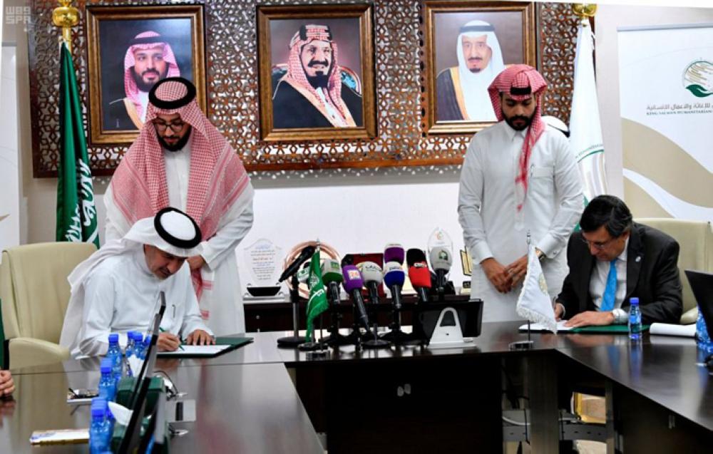 Dr. Abdullah Al-Rabeeah, adviser at the Royal Court and general supervisor of KSRelief, and Rashid Khalikov, assistant secretary general of OCHA for humanitarian partnerships with the Middle East and Central Asia, sign the agreement in Riyadh on Tuesday. -- SPA