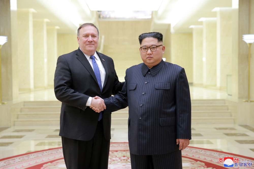 A photo released by the official North Korean Central News Agency (KCNA), the state news agency of North Korea, shows Kim Jong Un, right, chairman of the Workers’ Party of Korea and chairman of the State Affairs Commission of the Democratic People’s Republic of Korea, shaking hands with Mike Pompeo, left, secretary of State of the United States of America, in Pyongyang, North Korea, on May 9, 2018. — EPA